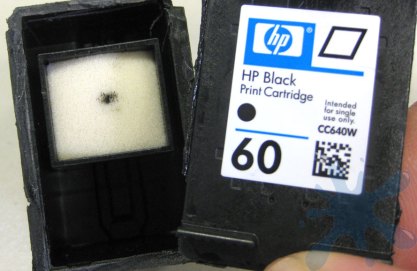 Cartridge cover comes off the HP 60 inkjet printer cartridge ink to reveal the internal cartridge structure.